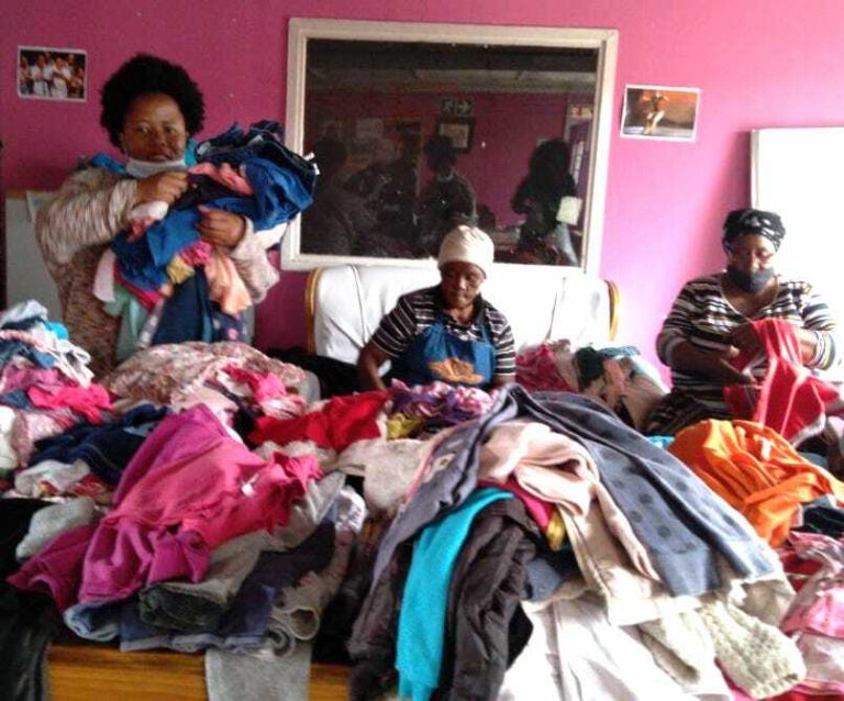 Women sorting clothes for ditribution